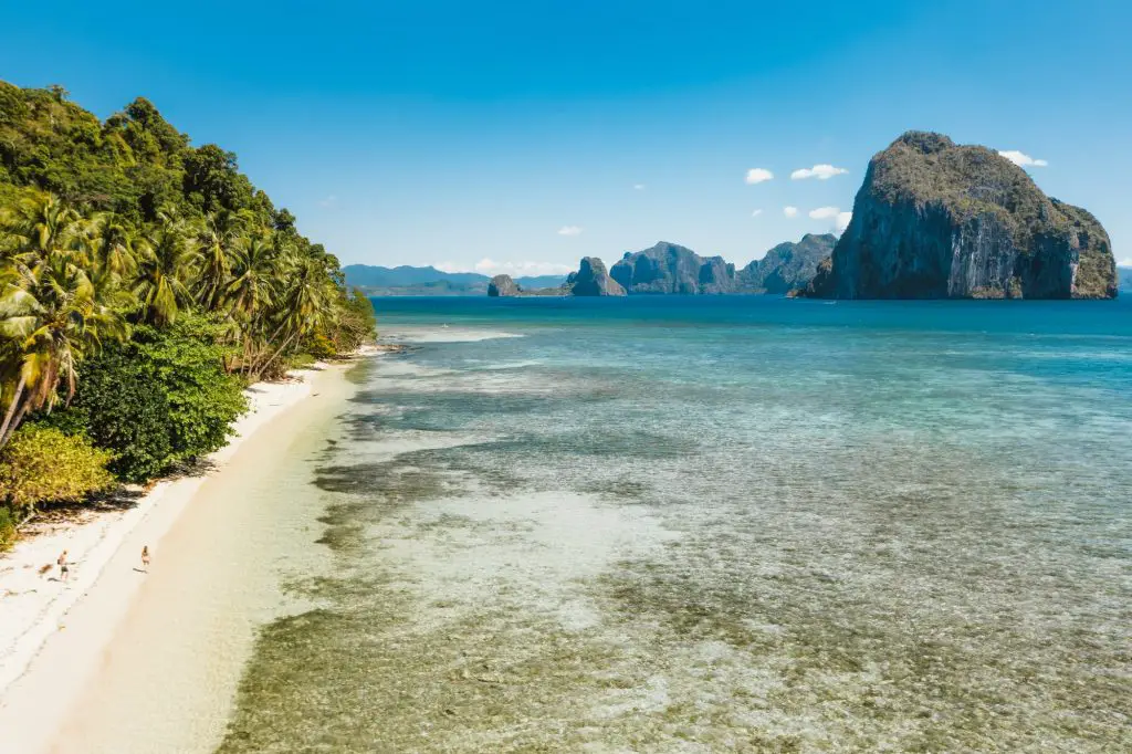 Aerial view of tropical Las Cabanas beach in El Nido, Palawan, Philippines